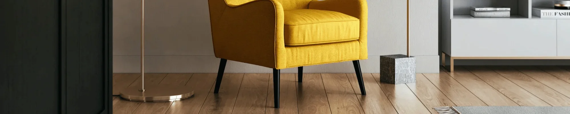 Yellow armchair in a modern seating area with wood floors